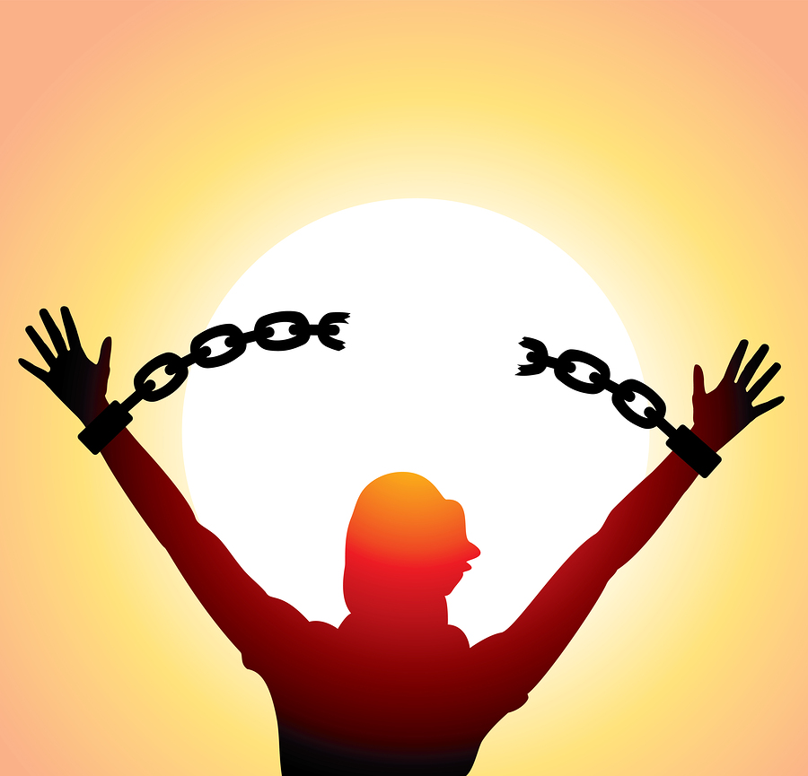 vector silhouette of a girl with raised hands and broken chains